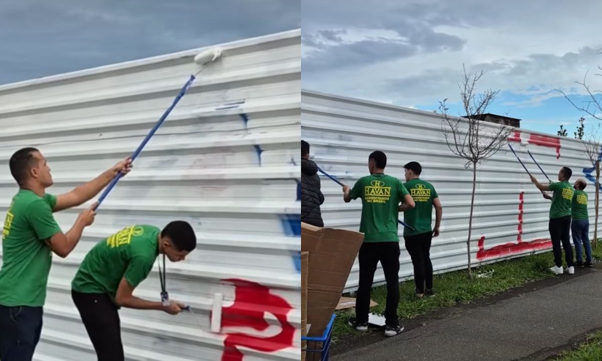 Muro sendo pintado na Havan Curitiba após ser pichado