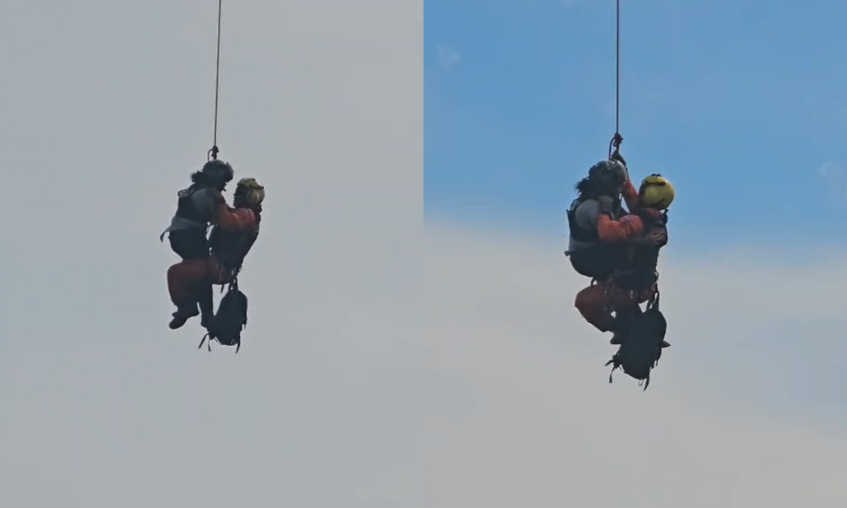 Foto mostra mulher jogada de penhasco pelo ex sendo resgatada e içada por bombeiro 'pendurado' a helicóptero