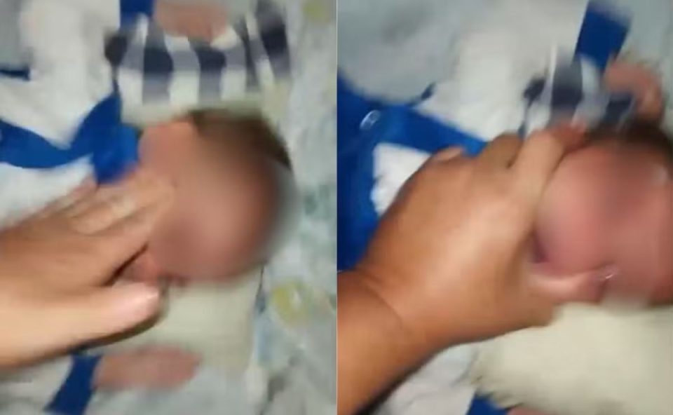Trecho do vídeo em que mãe agride ao próprio filho, de 5 meses, para cobrar pensão alimentícia.